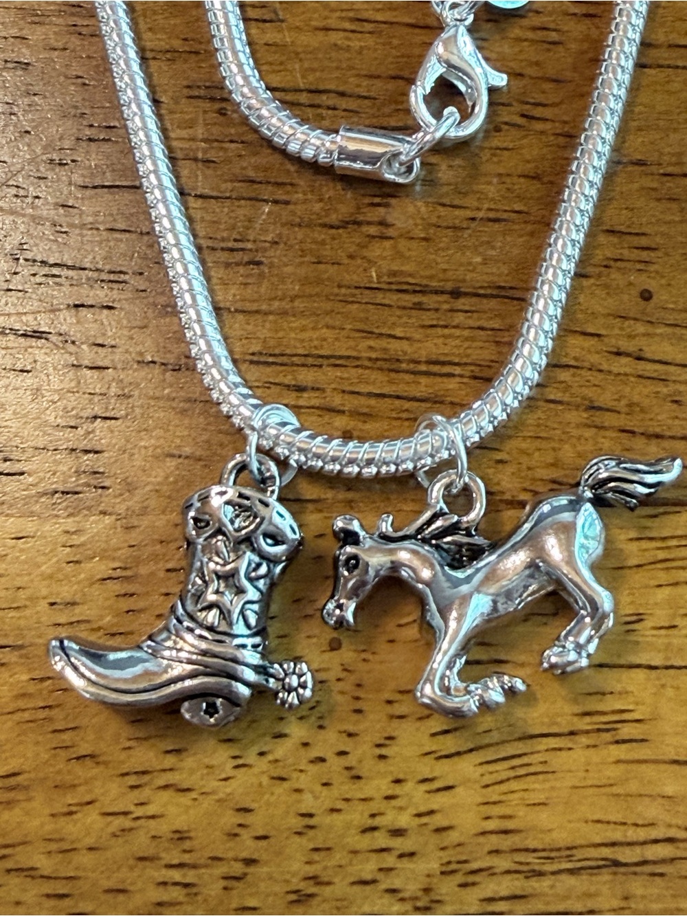 925 sterling silver necklace.23”snake chain,running horse & cowboy boot pendants
